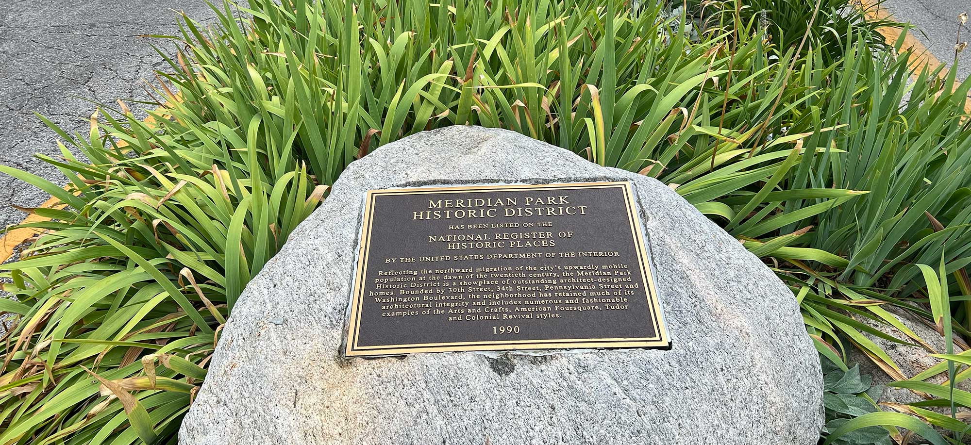 A plaque designating Meridian Park Historic District on the National Register of Historic Places